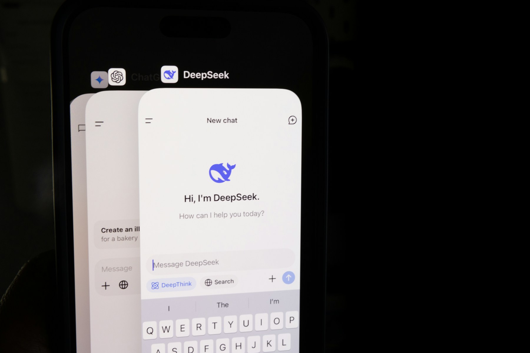 A phone displays the open DeepSeek app alongside other artificial intelligence apps.